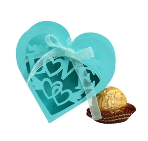 Laser-cut Tiffany blue heart favor box with LOVE motif and matching satin ribbon bow