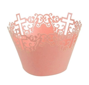 Close-up of pink laser-cut cupcake wrapper with religious cross and ornate patterns