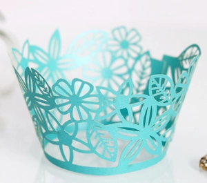 Detailed laser-cut cupcake wrapper in Tiffany blue with elegant floral and leaf patterns