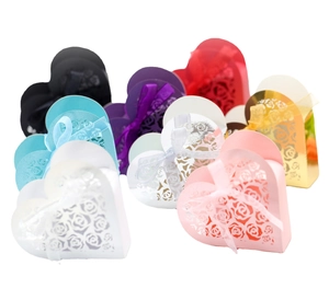 Laser cut heart wedding favor boxes with rose patterns and matching ribbons in multiple colors