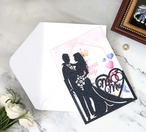Detail view of black glitter laser-cut Mr & Mrs invitation with pink princess card