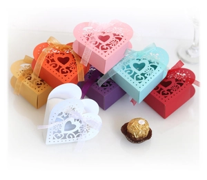 Laser-cut heart gift boxes in multiple colors with ribbons for wedding candy packaging