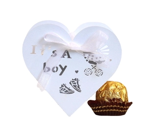 Light blue heart-shaped baby shower candy box with It's a boy text and white ribbon