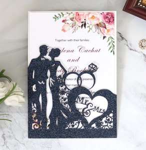 Navy blue glitter laser cut wedding invitation with Mr & Mrs silhouette on marble background
