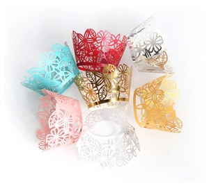 Laser cut floral cupcake wrappers in various metallic colors for party dessert decoration