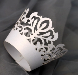 Detailed laser-cut white lace cupcake wrapper with elegant European floral hollow patterns