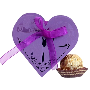 Purple laser-cut heart favor box with floral patterns and a matching satin ribbon bow
