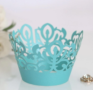 Elegant laser-cut lace cupcake wrappers in Tiffany blue for wedding dessert decor