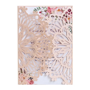 Laser cut champagne gold wedding invitation with floral inner card on white background