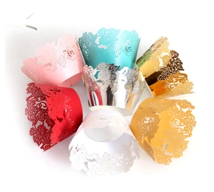 Intricate laser-cut floral cupcake wrappers in multiple colors for party decoration