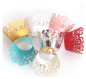 Elegant laser-cut cupcake wrappers with crown patterns in seven assorted vibrant colors