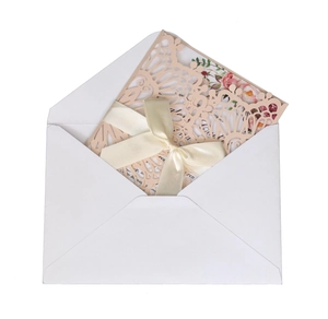 Laser cut light pink wedding invitation set with floral inner card and satin ribbon