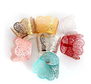 Laser cut lace cupcake wrappers in various colors including gold, white, and silver