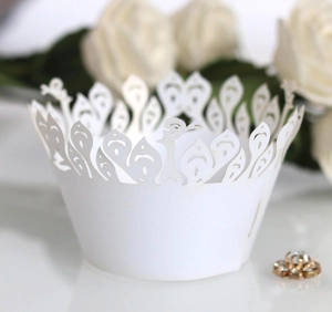 Laser cut peacock pattern cupcake wrappers in white paper for wedding cake decorations