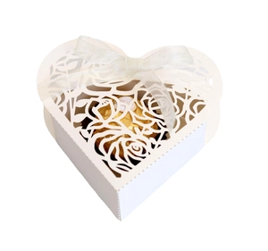 White heart-shaped laser-cut candy box with rose pattern and white chiffon ribbon