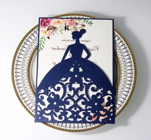 Detailed laser-cut pattern of an elegant woman silhouette on dark blue invitation card
