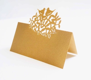 Laser-cut folding place card with birds design made of rustic kraft paper for weddings