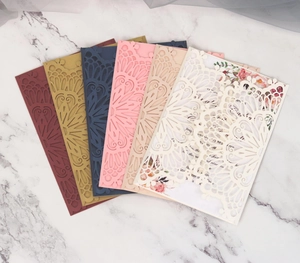 Laser cut pearl paper wedding invitations set with floral inner sheets in multiple colors