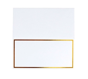 Macro detail of white textured place card with elegant gold foil rectangular border