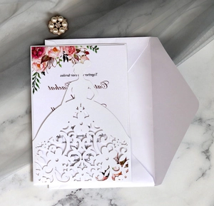 Detail of laser-cut bridal silhouette invitation with intricate floral hollow patterns
