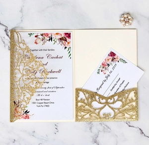 Detail of laser-cut glitter gold wedding invitation set with floral card and RSVP