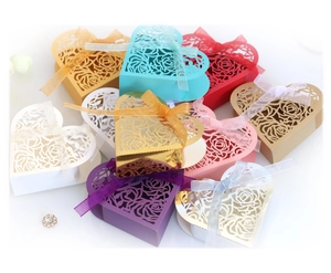 Laser cut heart shaped candy boxes with rose pattern and organza ribbons in various colors
