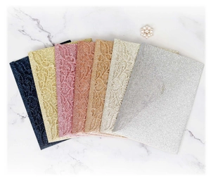 Detail of glitter tri-fold greeting cards with laser-cut floral patterns in six colors