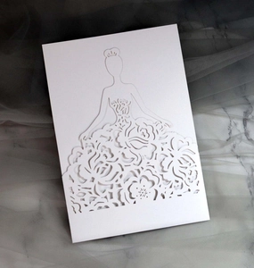 Detailed laser-cut wedding invitation featuring an elegant woman in a floral dress