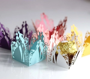 Laser cut hollow wedding candy boxes featuring bride and groom silhouettes in various colors
