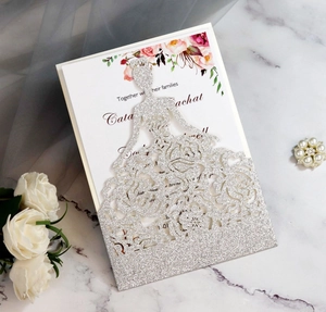 Detail of silver glitter bride silhouette wedding invitation with laser-cut roses