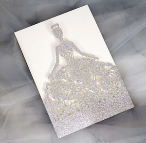 Detail of silver glitter laser cut invitation with floral rose and elegant bride design