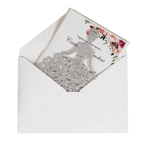 Detailed laser-cut silver glitter wedding invitation with elegant pink floral inner card