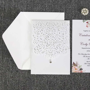 Laser cut wedding invitation card with white rose pattern and pearl paper finish