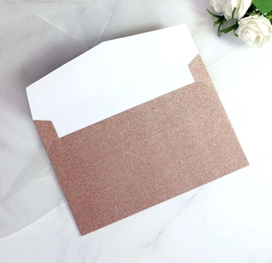 Rose gold glitter envelope with clean white lining and elegant textured finish
