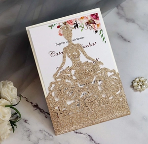 Close-up of glitter laser cut girl silhouette invitation card with floral insert detail