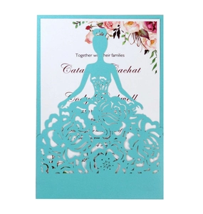 Detail of laser-cut wedding invitation featuring a blue hollow princess dress outer cover