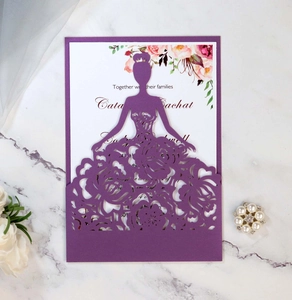 Detail of purple laser cut wedding invitation with elegant female silhouette floral design