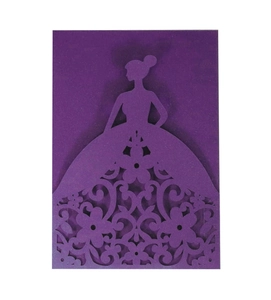 Macro detail of laser-cut dark purple invitation featuring an elegant female silhouette