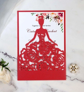 Detail of laser-cut red wedding invitation with floral bride silhouette and inner card