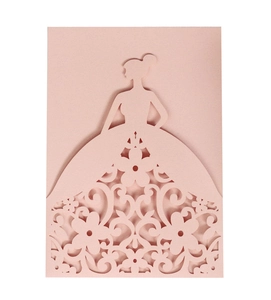 Detail of laser-cut wedding invitation featuring an elegant pink gown silhouette