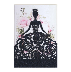 Macro view of laser-cut black glitter invitation with rose patterns and silhouette