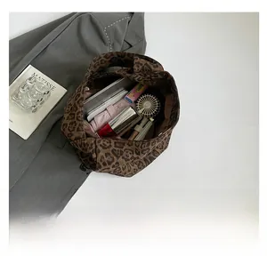 Top view of large leopard print tote bag showing spacious interior with daily essentials