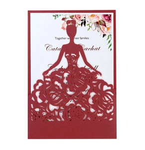 Detail of laser-cut wedding invitation featuring elegant crimson floral dress silhouette
