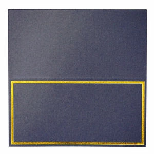 Close-up of deep blue place card featuring a refined gold foil border design
