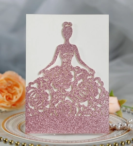 Macro shot of glittery pink laser-cut rose greeting card with elegant lady silhouette