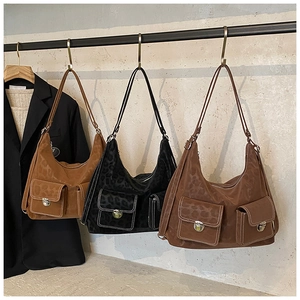 Detailed view of hobo bag featuring leopard embossing and double front pockets