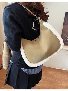 Chic khaki green suede shoulder bag with faux shearling trim and adjustable leather strap