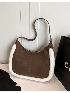 Brown suede hobo bag with white faux fur trim and adjustable leather shoulder strap