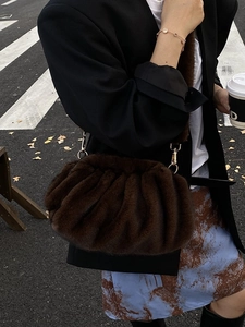 Chic dark brown faux fur cloud bag with elegant ruched design for winter outfits