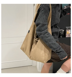 Side view of large khaki corduroy tote bag showing spacious capacity and soft drape